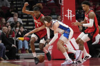 Houston Rockets' Jalen Green (4) tries to steal the ball from Washington Wizards' Corey Kispert during the first half of an NBA basketball game Wednesday, Jan. 25, 2023, in Houston. (AP Photo/David J. Phillip)