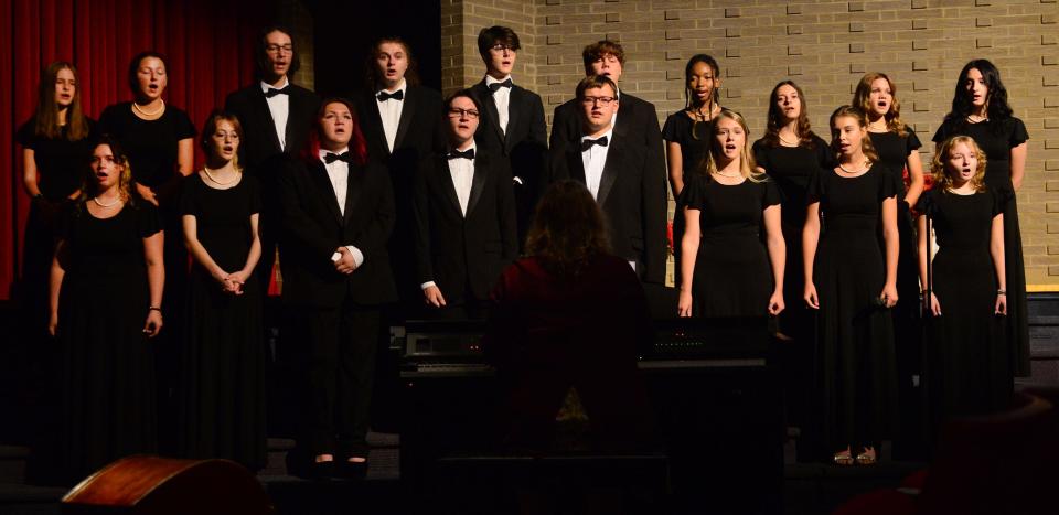 The Alliance High School Choralaires sing "Over the Rainbow" during the prelude to the 2023 Distinguished Alumni Induction Ceremony on Monday, Oct. 2, 2023, in the Alliance High School auditorium.