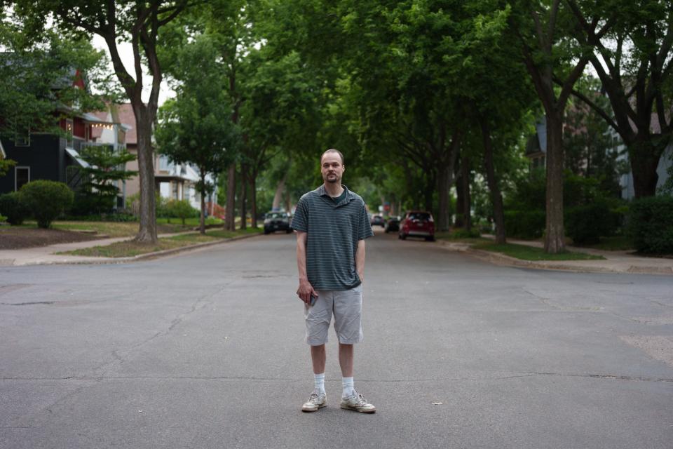 Jay Priebe stands for a portrait in his Twin Cities neighborhood.