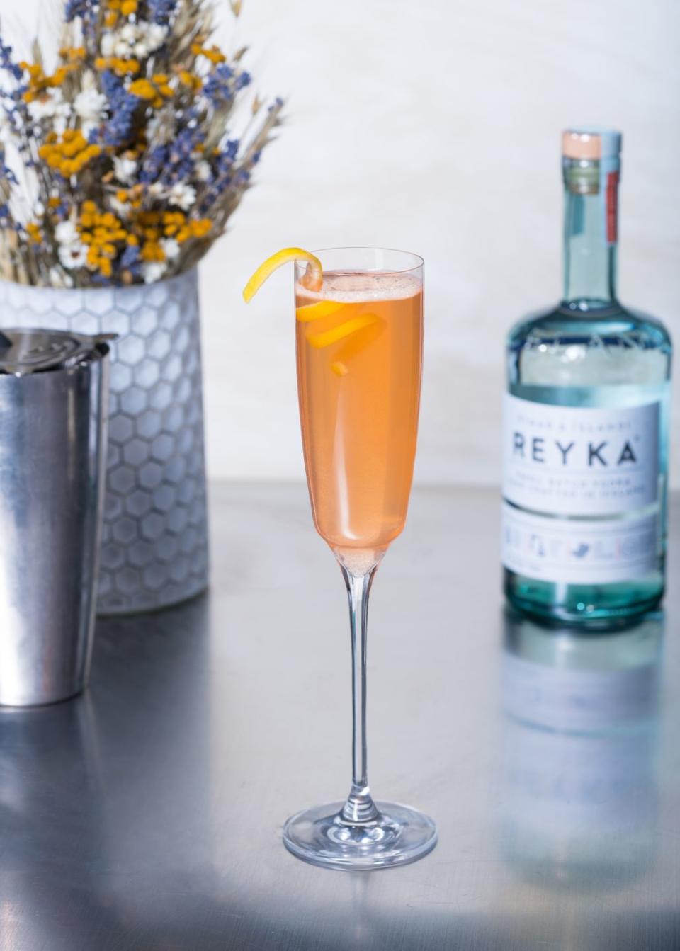 <p><strong>Ingredients</strong></p><p>1 oz Reyka Vodka <br>.5 oz Aperol <br>.5 oz honey syrup <br>.25 oz lemon juice <br>Top with champagne or prosecco </p><p><strong>Instructions</strong></p><p>Combine all ingredients except sparkling wine into a cocktail shaker. Serve in flute, top with champagne or prosecco and garnish with a lemon peel.<br></p>