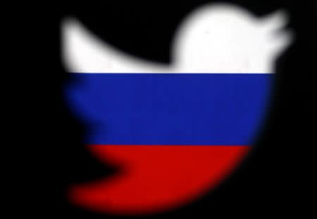 FILE PHOTO: A 3D-printed Twitter logo displayed in front of Russian flag is seen in this illustration picture, October 27, 2017. REUTERS/Dado Ruvic/Illustration/File Photo