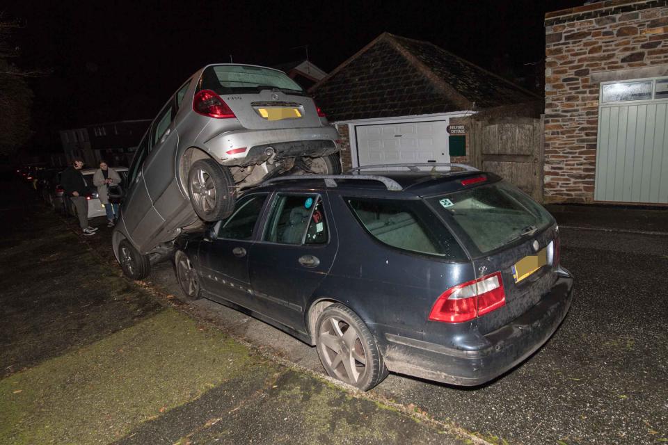 The student managed to reverse on to the bonnet of the other car. (SWNS)