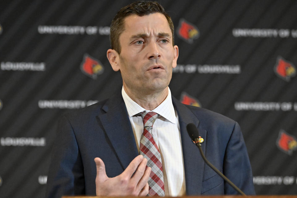 University of Louisville interim athletic director Josh Heird speaks to reporters following a meeting of the University Board of Trustees and the Louisville Athletic Association board, Wednesday, Jan. 26, 2022, in Louisville, Ky. The university and men’s basketball coach Chris Mack have mutually agreed to part ways, the school announced. Assistant Mike Pegues has been named interim coach for the remainder of the Cardinals' season. (AP Photo/Timothy D. Easley)