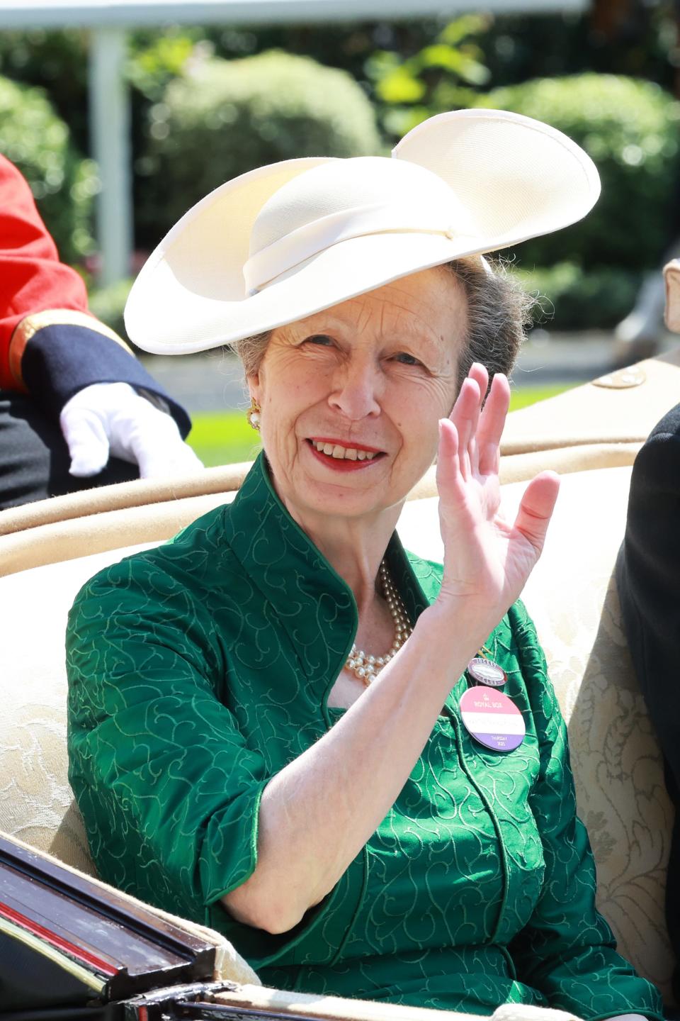 Princess Anne attends day three of Royal Ascot wearing a white hat and green dress