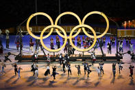 <p>TOKYO, JAPAN - JULY 23: Performers act out a routine in-front of the Olympic Rings during the Opening Ceremony of the Tokyo 2020 Olympic Games at Olympic Stadium on July 23, 2021 in Tokyo, Japan. (Photo by Dylan Martinez - Pool/Getty Images)</p> 