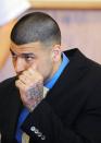 Former NFL New England Patriots football player Aaron Hernandez listens during a hearing at the Bristol County Superior Court House in Fall River, Massachusetts, June 16, 2014. Attorneys for former NFL star Aaron Hernandez on Monday called on a judge to throw out charges that the ex-tight end murdered a semiprofessional football player in June 2013, one of three homicides Hernandez is charged with. REUTERS/Faith Ninivaggi/POOL (UNITED STATES - Tags: CRIME LAW SPORT)