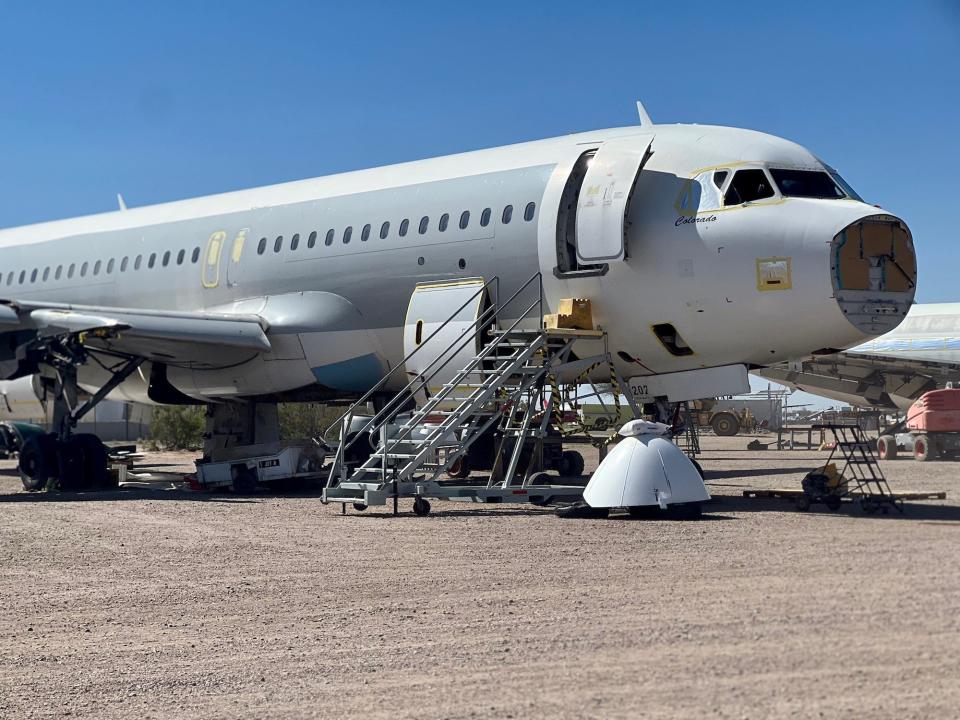 An aircraft in reclamation with no nosecone.