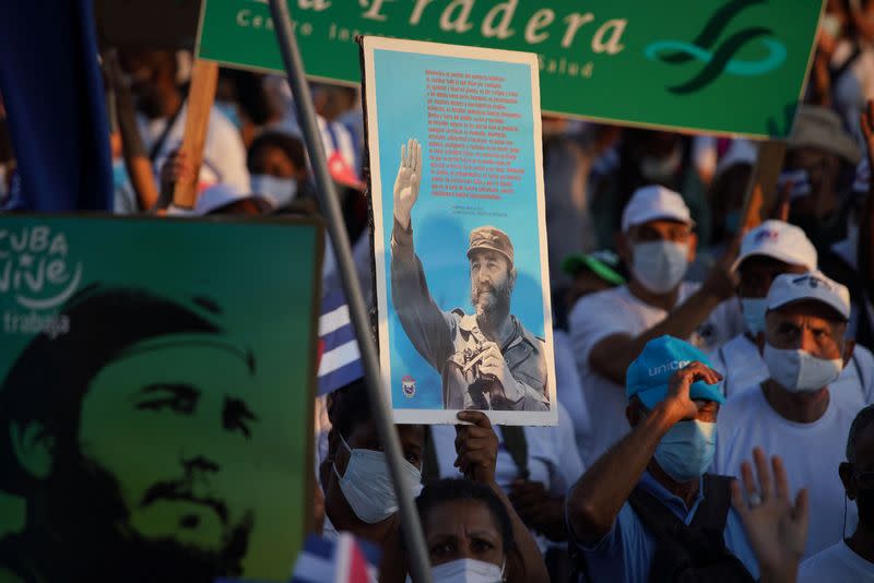 People parade during May Day in Havana