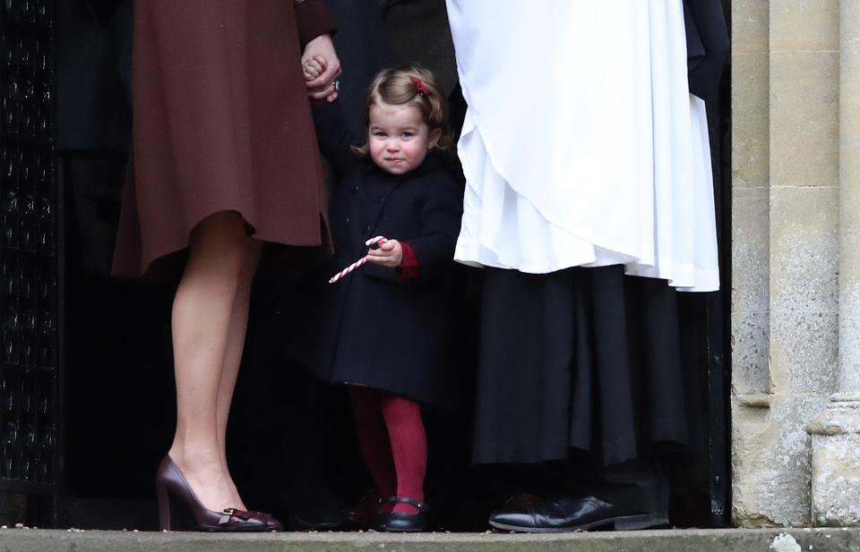 <p>Princess Charlotte clutched a candy cane as she left St Mark's Church on Christmas Day. (Getty Images)</p> 