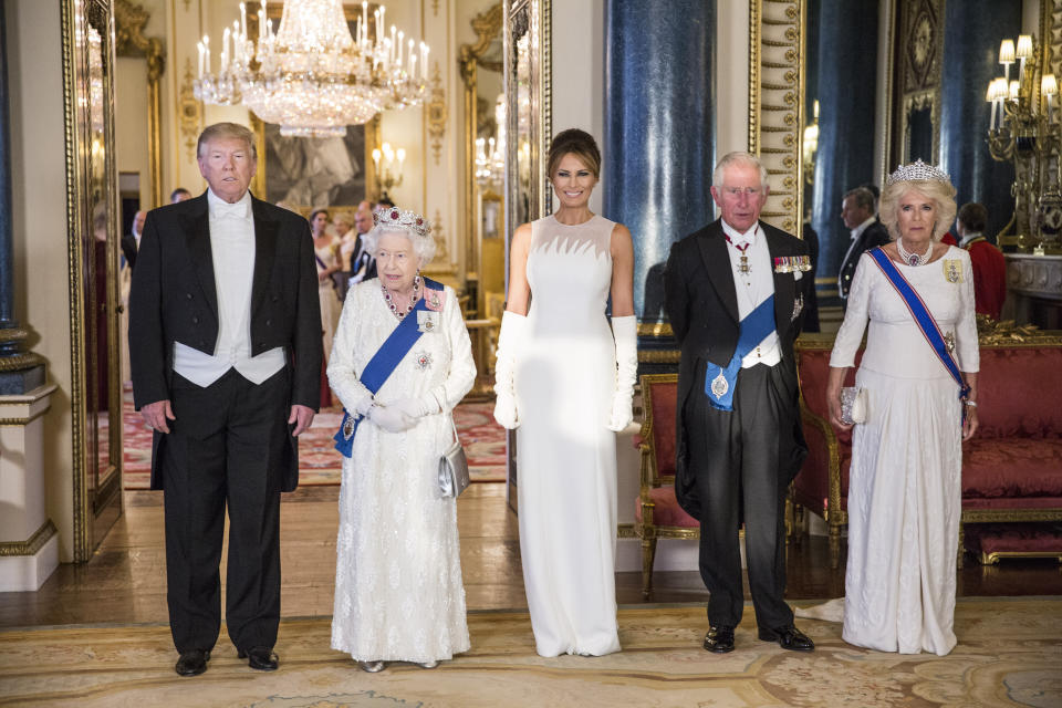 RETRANSMITTED CORRECTING BYLINE (left to right) US President Donald Trump, Queen Elizabeth II, Melania Trump, the Prince of Wales and the Duchess of Cornwall, during a group photo ahead of the State Banquet at Buckingham Palace, London, on day one of US President Donald Trump's three day state visit to the UK.