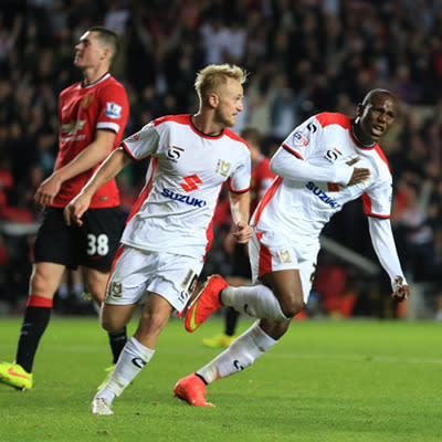 <p>Manchester United kicked off the 2014/15 football season in shocking fashion. With pressure mounting on new coach Louis van Gaal, the Red Devils were humiliated by third-tier club Milton Keynes Dons, who thrashed them 4-0 in the second round of the League Cup.</p>