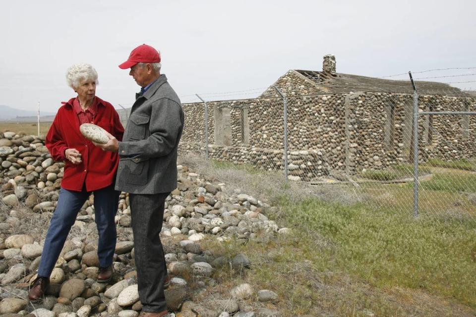 Siblings Paula Holm and Ludwig Bruggemann toured the property in 2015 where they lived as children. Behind them is the Bruggemann warehouse, now part of the Manhattan Project National Historical Park.