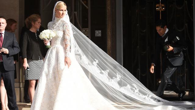 This has to be one of the best celebrity wedding dresses we've ever seen. Nicky Hilton looked gorgeous in a lacy, long-sleeved Valentino Couture wedding gown on Friday, as she stepped out of her London hotel headed to marry banking heir James Rothschild at Kensington Palace. FameFlynet <strong>PHOTOS: Beautiful Brides -- The Best Celebrity Wedding Dresses</strong> FameFlynet Check out the 31-year-old socialite's amazing train. FameFlynet Nicky had quite the hand in designing the gown as well. "Ever since I was a little girl I wanted Valentino to design my wedding dress. Valentino is the definition of timeless elegance, I don't think there's another couture house like it," she told Harper's Bazaar. <strong> WATCH: Nicky Hilton Marries James Rothschild in Lavish Ceremony </strong> "I went through every look from their collections over the last 10 years," she added. "I studied the archives, and I just sent notes about details I liked -- a certain sleeve, a high neckline." Valentino And the result -- six months later! -- is absolutely stunning: a custom couture gown with guipure lace, crystal embellishments, a balloon skirt and a nearly 10-foot train. The bride completed her look with a pair of white Christian Louboutins, inscribed with "Mrs. Rothschild." <strong>WATCH: Oops! Nicky Hilton Bares Her Butt in Serious Versace Wardrobe Malfunction</strong> Check out another memorable celebrity wedding dress -- Angelina Jolie's Versace gown when she married longtime love Brad Pitt last September -- in the video below.