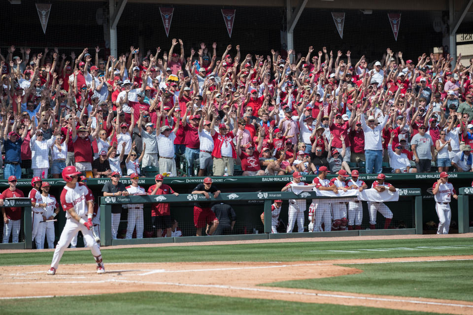 Jun 10, 2019; Fayetteville, AR, USA; Arkansas Razorbacks fans chant as Arkansas Razorbacks shortstop Casey Martin (15) is at bat during the game against the Mississippi Rebels at Baum-Walker Stadium. Mandatory Credit: Brett Rojo-USA TODAY Sports