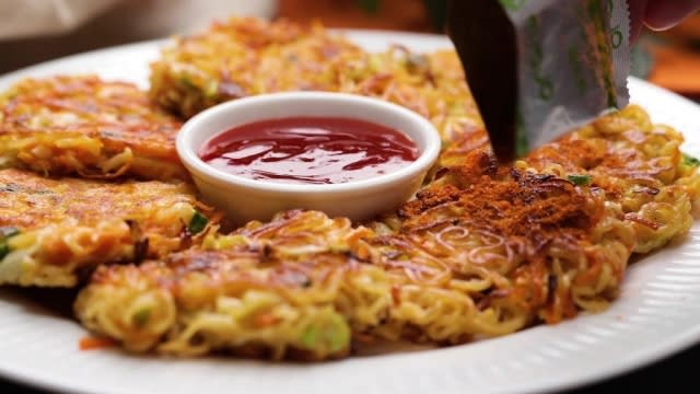 dusting instant noodle pancakes with seasoning