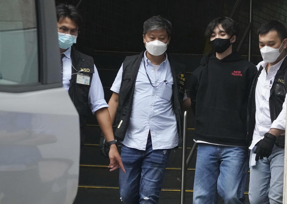 Wong Yat-chin, second from right, leader of Hong Kong Student Politicism escorted after being arrested by national security police in Hong Kong, Monday, Sept. 20, 2021. Hong Kong national security police on Monday arrested at least two members of the Hong Kong Student Politicism, including Wong and and secretary Chan Chi-sum, amid a sweeping crackdown on dissent in the semi-autonomous Chinese city. (AP Photo)