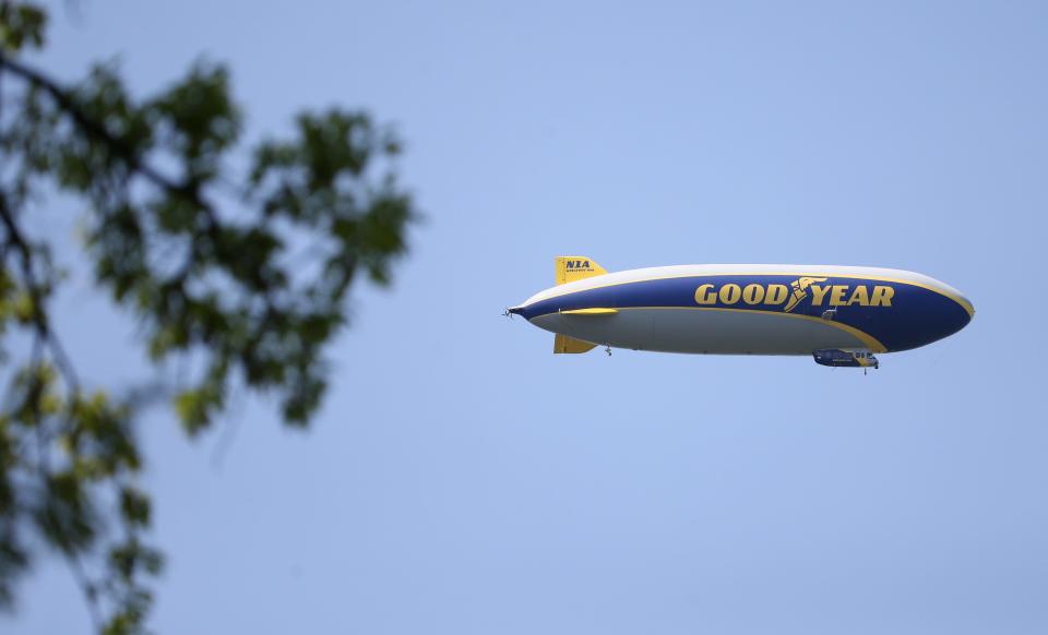 The Goodyear blimp flies high over the back nine during the first round at the PGA Championship at Oak Hill Country Club Thursday, May 18, 2023. 