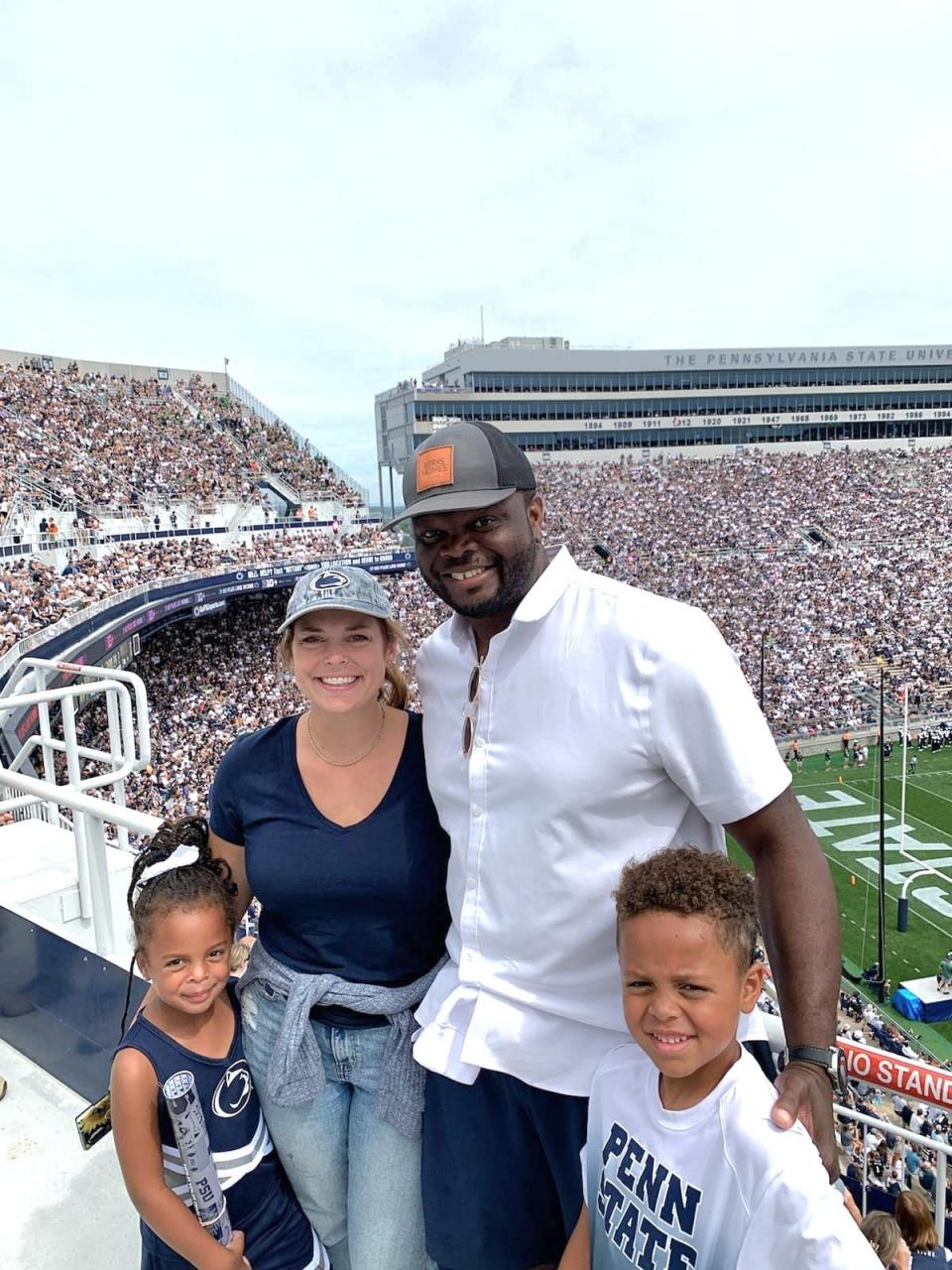 Former Penn State linebacker Bani Gbadyu attended the Nittany Lions' Sept. 10 home game vs. Ohio University with his wife, Molly, and their two oldest children, Trey, 6, (right) and Aspen, 4. Bani was diagnosed with pancreatic cancer a few weeks later.
