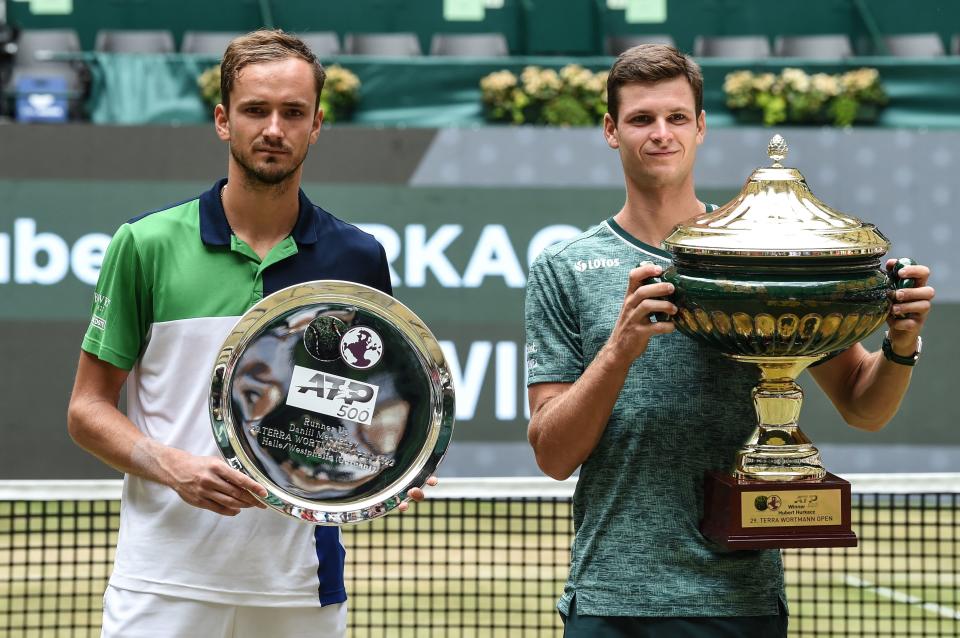 Daniil Medvedev and Hubert Hurkacz, pictured here with their trophies after the Halle Open final.