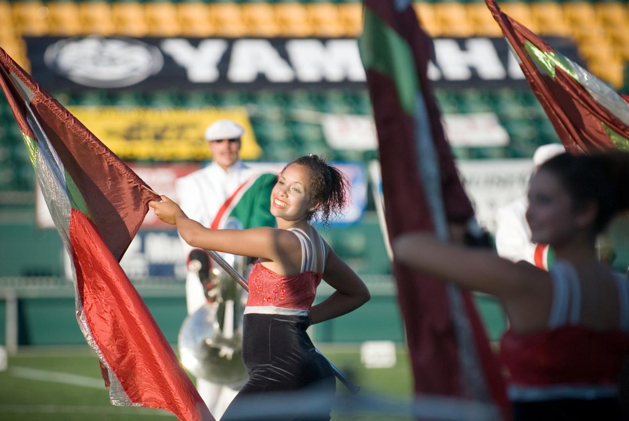 In this file photo from 2008, a 15-year-old Hannah Vergo of Irondequoit (center) gives a smile during the Rochester Crusaders preliminary program at the 44th Annual Drum Corps Associates 2008 World Championships.