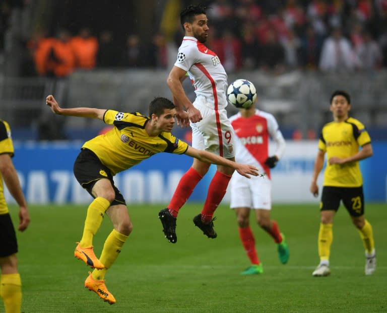 Dortmund's midfielder Julian Weigl and Monaco's forward Radamel Falcao vie for the ball during the UEFA Champions League 1st leg quarter-final football match April 12, 2017