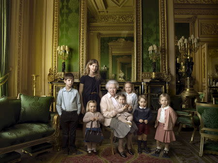 Britain's Queen Elizabeth II poses with her five great-grandchildren and her two youngest grandchildren in the Green Drawing Room, part of Windsor Castle's semi-State apartments. The children are: James, Viscount Severn (left), 8, and Lady Louise (second left), 12, the children of The Earl and Countess of Wessex; Mia Tindall (holding The Queen's handbag), the two year-old-daughter of Zara and Mike Tindall; Savannah (third right), 5, and Isla Phillips (right), 3, daughters of The Queen's eldest grandson Peter Phillips and his wife Autumn; Prince George (second right), 2, and in The Queen's arms and in the tradition of Royal portraiture, the youngest great-grandchild, Princess Charlotte (11 months), children of The Duke and Duchess of Cambridge, in this official photograph, released by Buckingham Palace to mark her 90th birthday April 20, 2016 Credit must read: c2016 Annie Leibovitz/Handout via