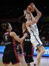 United States' Breanna Stewart, right, gets through Belgium's defenders Antonia Delaere, left, and Julie Allemand during their women's Basketball World Cup game in Sydney, Australia, Thursday, Sept. 22, 2022. (AP Photo/Mark Baker)