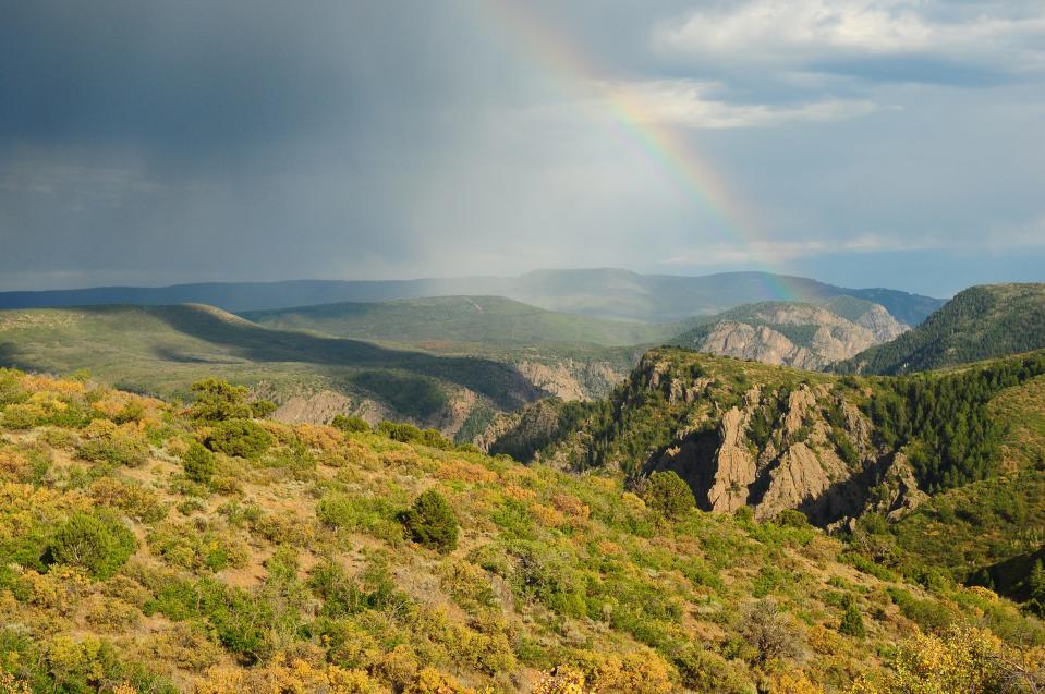 A rainbow is seen over South Rim at Black Canyon of the Gunnison National Park.