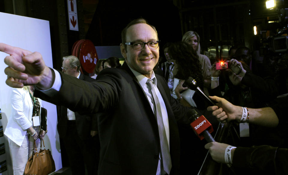 American actor Kevin Spacey speaks to the press as he arrives for the premiere of "Spirit Of A Denture" in Johannesburg, South Africa, Saturday, May 12, 2012. Spacey spoke about his international outlook during a brief visit to Johannesburg for the premiere of the South African short film he helped produce and in which he stars. (AP Photo/Denis Farrell)