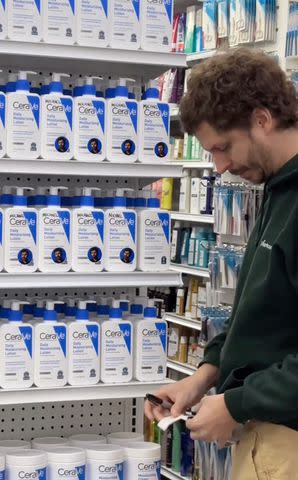 <p>Haley Kalil/Instagram</p> Michael Cera in a drug store signing CeraVe bottles