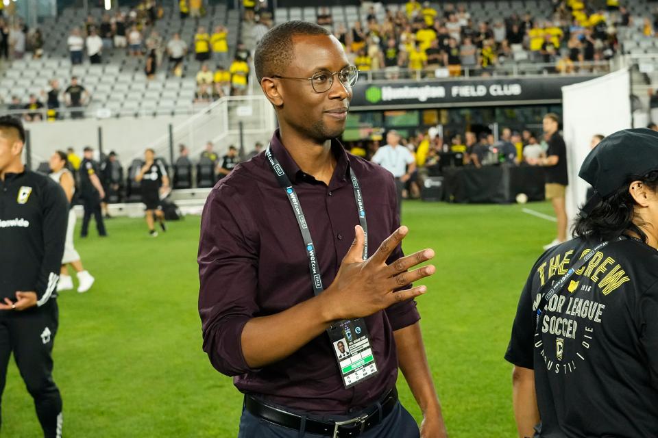 Jul 6, 2024; Columbus, OH, USA; Columbus Crew general manager Issa Tall greets players on the field following the MLS soccer match at Lower.com Field. The Crew won 4-0.