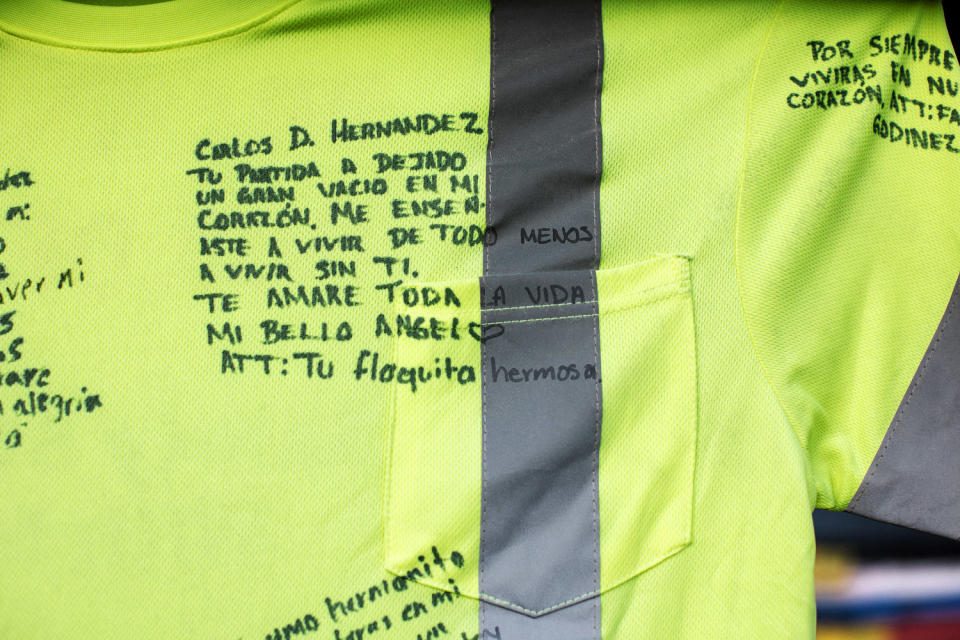 Notes on a shirt at a memorial (Rosem Morton for NBC News)