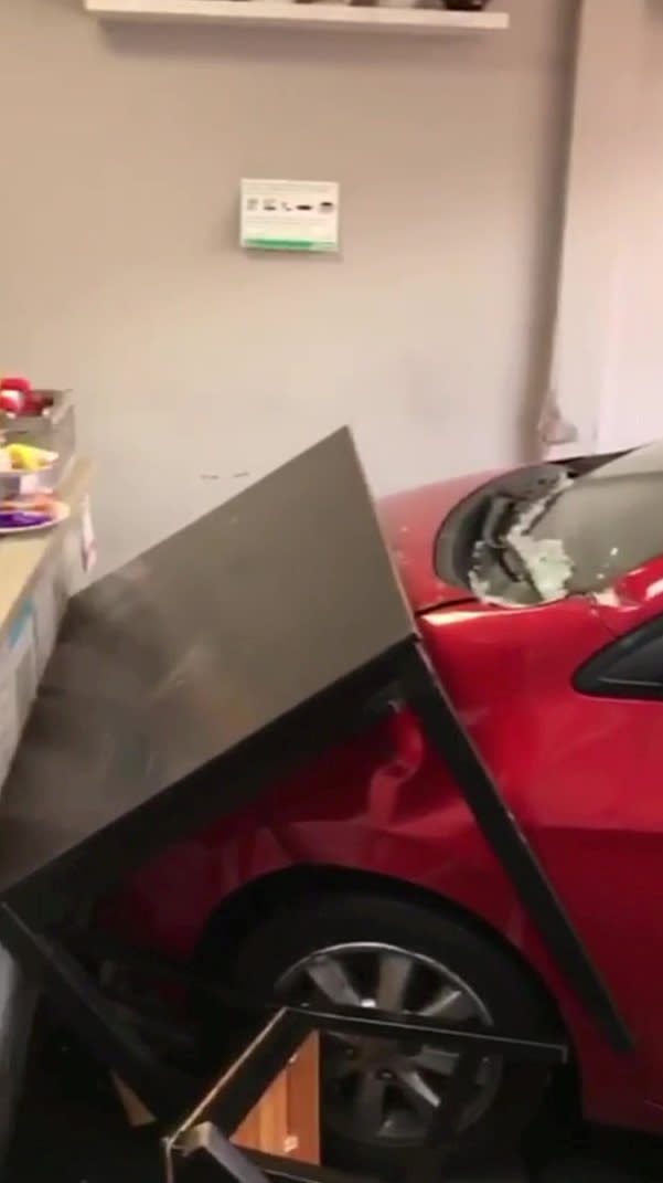 Customers escaped death by inches after a runaway car ploughed through the front of a busy cafe while they were eating breakfast