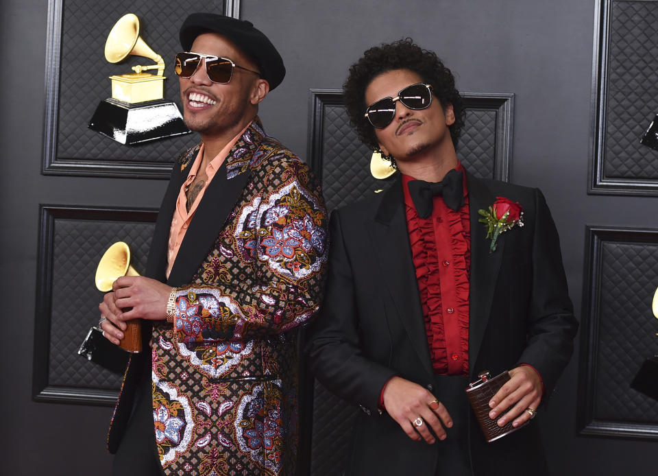 FILE - Anderson .Paak, left, and Bruno Mars, of the duo Silk Sonic, appear at the 63rd annual Grammy Awards in Los Angeles on March 14, 2021. The duo earned four Grammy nominations including record of the year, song of the year, best R&B song and best R&B performance.(Photo by Jordan Strauss/Invision/AP, File)