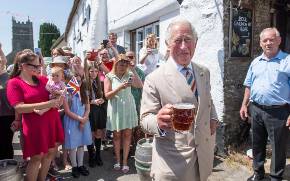 Prince Charles, aka The Mountain Goat, enjoying a pint in Devon last month - PA