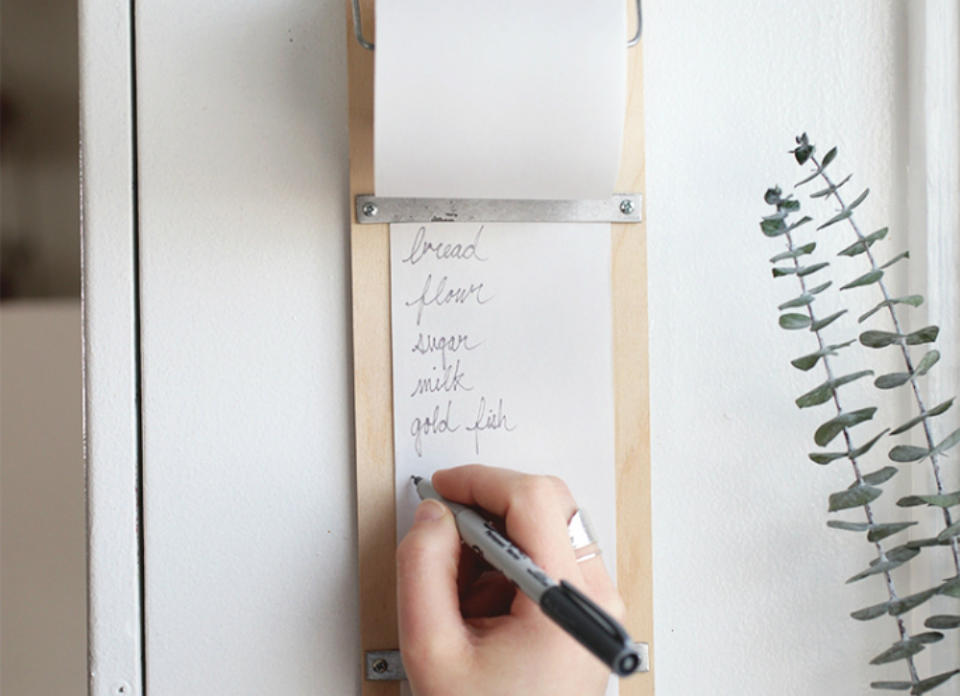 <body> <p>This stationary shopping list pad resolves the <a rel="nofollow noopener" href=" http://www.bobvila.com/slideshow/a-home-you-both-love-12-solutions-for-your-biggest-decor-disputes-49792?bv=yahoo" target="_blank" data-ylk="slk:dilemma;elm:context_link;itc:0;sec:content-canvas" class="link ">dilemma</a> of forgotten groceries, while doing away with disorderly piles of paper and pens that take up space in the kitchen junk drawer. A birch plywood sheet forms the foundation of the list pad, while galvanized wire, screw eye hooks, and small steel plates serve up a never-ending supply of paper for jotting down essentials.</p> <p><strong>Related: <a rel="nofollow noopener" href=" http://www.bobvila.com/slideshow/11-cheap-cures-for-a-cluttered-kitchen-49769?bv=yahoo" target="_blank" data-ylk="slk:11 Cheap Cures for a Cluttered Kitchen;elm:context_link;itc:0;sec:content-canvas" class="link ">11 Cheap Cures for a Cluttered Kitchen</a> </strong> </p> </body>