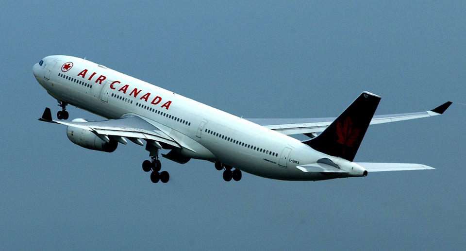 An Air Canada passenger has told of waking up alone in a dark plane after falling asleep on the flight.