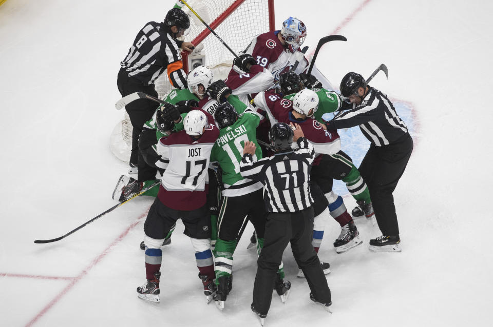 Dallas Stars and the Colorado Avalanche players rough it up during the third period of Game 3 of an NHL hockey second-round playoff series, Wednesday, Aug. 26, 2020, in Edmonton, Alberta. (Jason Franson/The Canadian Press via AP)