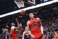 Toronto Raptors guard Dalano Banton (45) celebrates a point against the Washington Wizards during first-half NBA basketball game action in Toronto, Sunday, Dec. 5, 2021. (Cole Burston/The Canadian Press via AP)