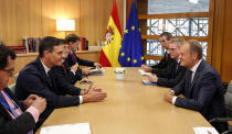 Spanish Primer Minister Pedro Sanchez, left, meets with European Union Council President Donald Tusk, right, on the sidelines of an EU summit at the Europa building in Brussels, Wednesday, Oct. 17, 2018. European Union leaders are converging on Brussels for what had been billed as a "moment of truth" Brexit summit but which now holds little promise for a breakthrough. (Julien Warnand,Pool Photo via AP)