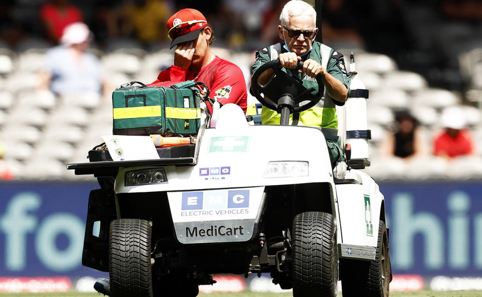 Nic Maddinson, pictured here being taken from the field on a medicab after suffering a serious knee injury.