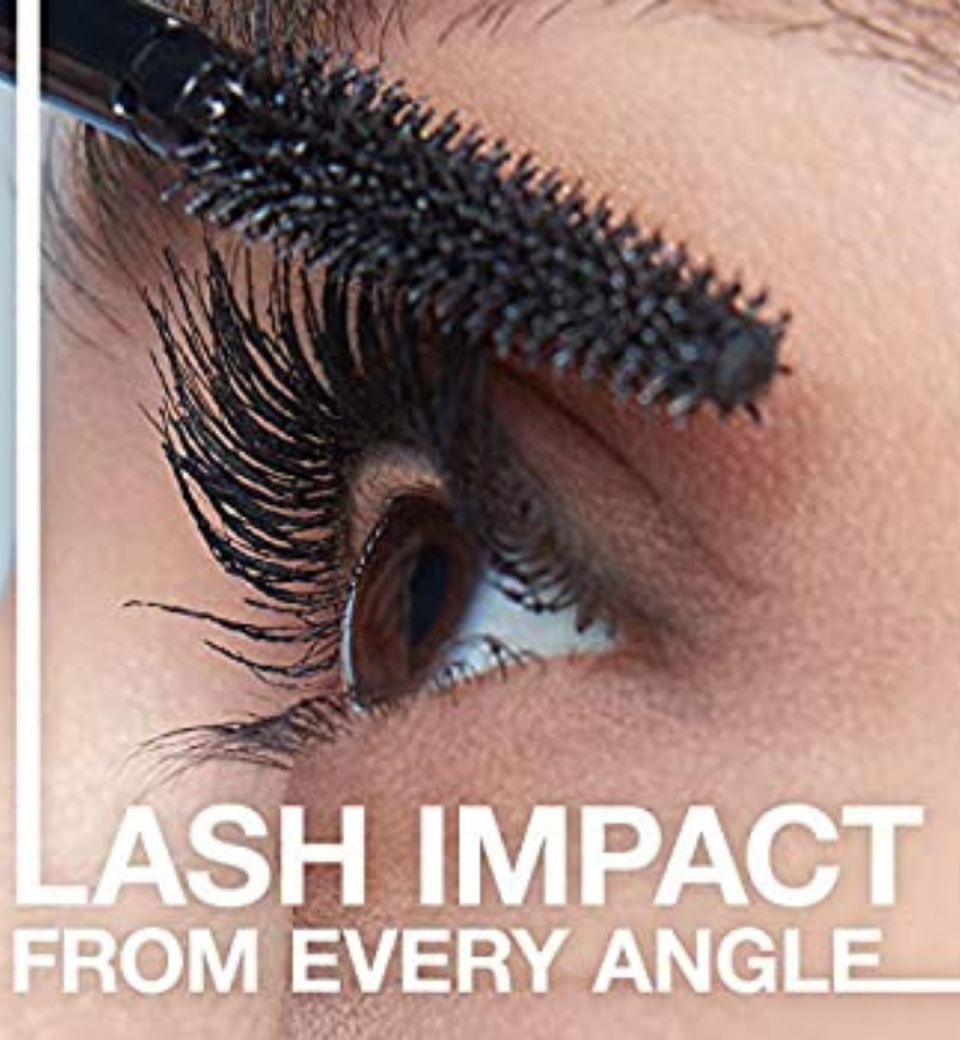 Close-up of mascara being brushed onto the eyelashes.