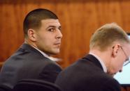 Former New England Patriots football player Aaron Hernandez sits with his attorney Charles Rankin during his murder trial at Bristol County Superior Court in Fall River, Massachusetts February 11, 2015. REUTERS/Ted Fitzgerald