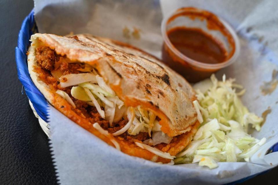 A traditional gordita, with added cabbage and salsa, is plated at Lucy’s Gorditas in Fresno on Wednesday, April 19, 2023.