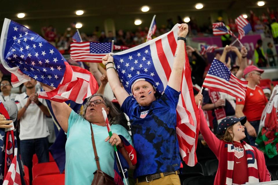 USA supporters cheer at the end of the World Cup, group B football match between the United States and Wales, at the Ahmad Bin Ali Stadium in Doha, Qatar, Tuesday, Nov. 22, 2022. The game ended in a 1-1 draw. (AP Photo/Francisco Seco)