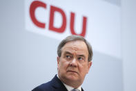 German Christian Democratic Union Party Chairman Armin Laschet briefs the media after a meeting of the party's board at the headquarters in Berlin, Germany, Monday, April 12, 2021. The leadership of Chancellor Angela Merkel's party CDU has backed party chairman Armin Laschet's bid to become the center-right candidate as Germany's next chancellor in the upcoming general elections. (AP Photo/Markus Schreiber, Pool)