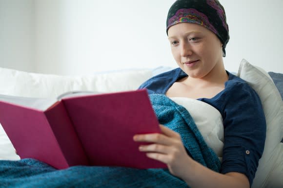 Cancer patient holding a book
