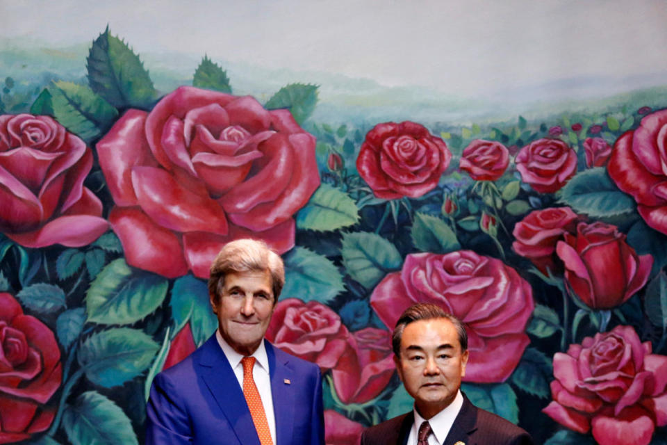 U.S. Secretary of State John Kerry greets China’s Foreign Minister Wang Yi 