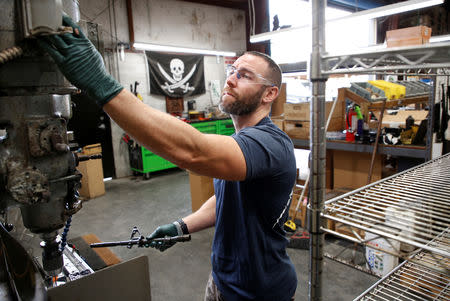 Rodger Brown works on a front sight post assembly at Spike's Tactical LLC, a gunmaker in Apopka, Florida, U.S. December 10, 2018. Picture taken December 10, 2018. REUTERS/Gregg Newton