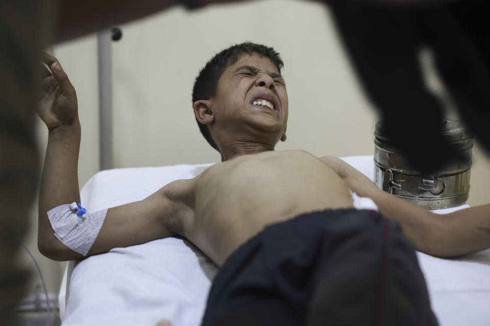 A boy injured in the shelling from the Syrian government positions gets treated in a hospital in Idlib, Syria, Friday, Oct. 6, 2023. (AP Photo/Ghaith Alsayed)
